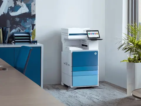 An HP colour multifunction copier in the corner of an office